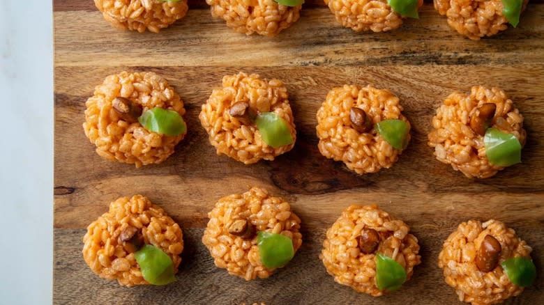 Rice Krispie pumpkins on cutting board