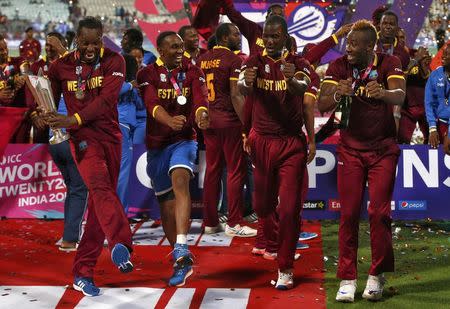 Cricket - England v West Indies - World Twenty20 cricket tournament final - Kolkata, India - 03/04/2016. West Indies players celebrate with the trophy after winning the final. REUTERS/Adnan Abidi