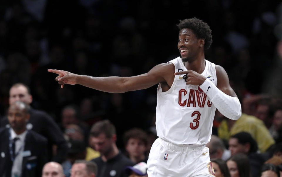 FILE - Cleveland Cavaliers' Caris LeVert reacts after making a 3-point basket against the Brooklyn Nets during the second half of an NBA basketball game March 21, 2023, in New York. The Cavaliers opened free agency by agreeing with LeVert on a two-year, $32 million contract, a person familiar with the negotiations told The Associated Press on Friday, June 30. (AP Photo/Noah K. Murray, File)