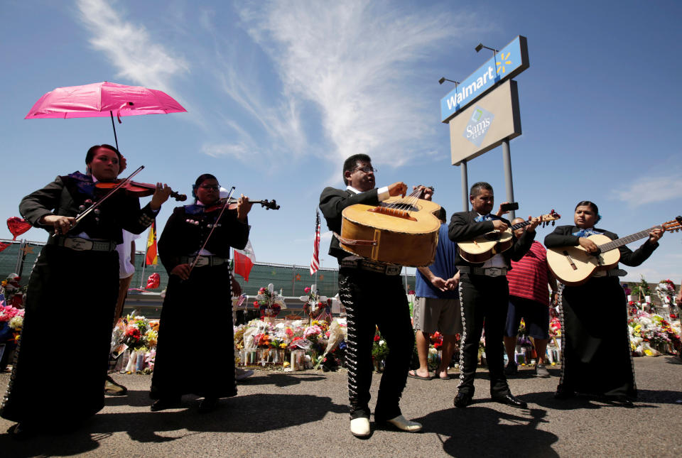 Mariachis play during a tribute to the victims of a mass shooting at a Walmart store, in the growing memorial in El Paso, Texas, U.S., August 18, 2019. REUTERS/Jose Luis Gonzalez