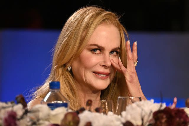 <p>Michael Kovac/Getty </p> Nicole Kidman cries during Keith Urban’s speech on April 27.