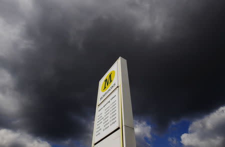 A Morrisons sign is seen outside a supermarket in north London, England in this March 14, 2013 file photo. REUTERS/Luke MacGregor/Files
