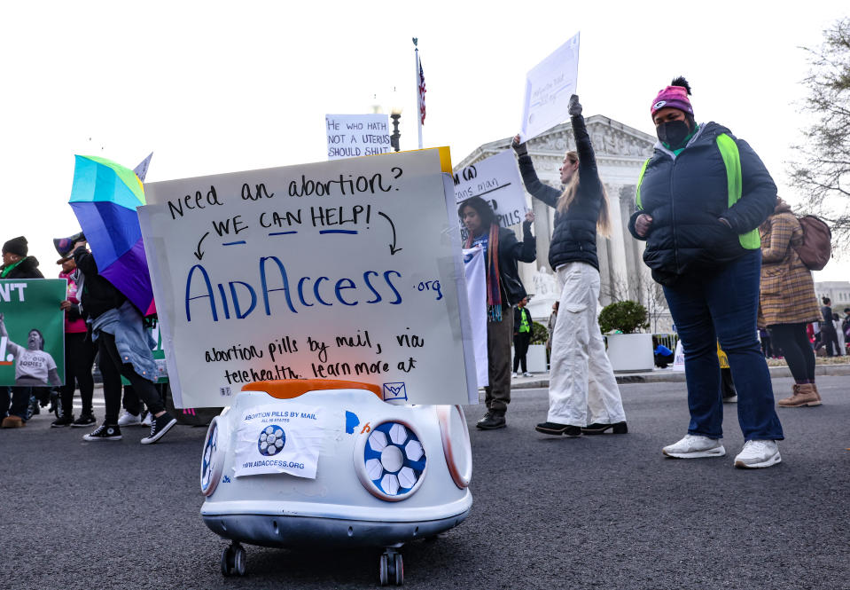 A delivery robot demonstrates the delivery of abortion pills by mail during the 