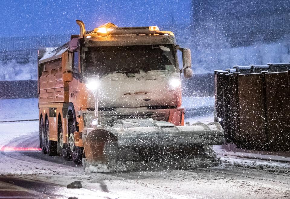 A snowplough on the road at Leeming Bar in North Yorkshire (PA)