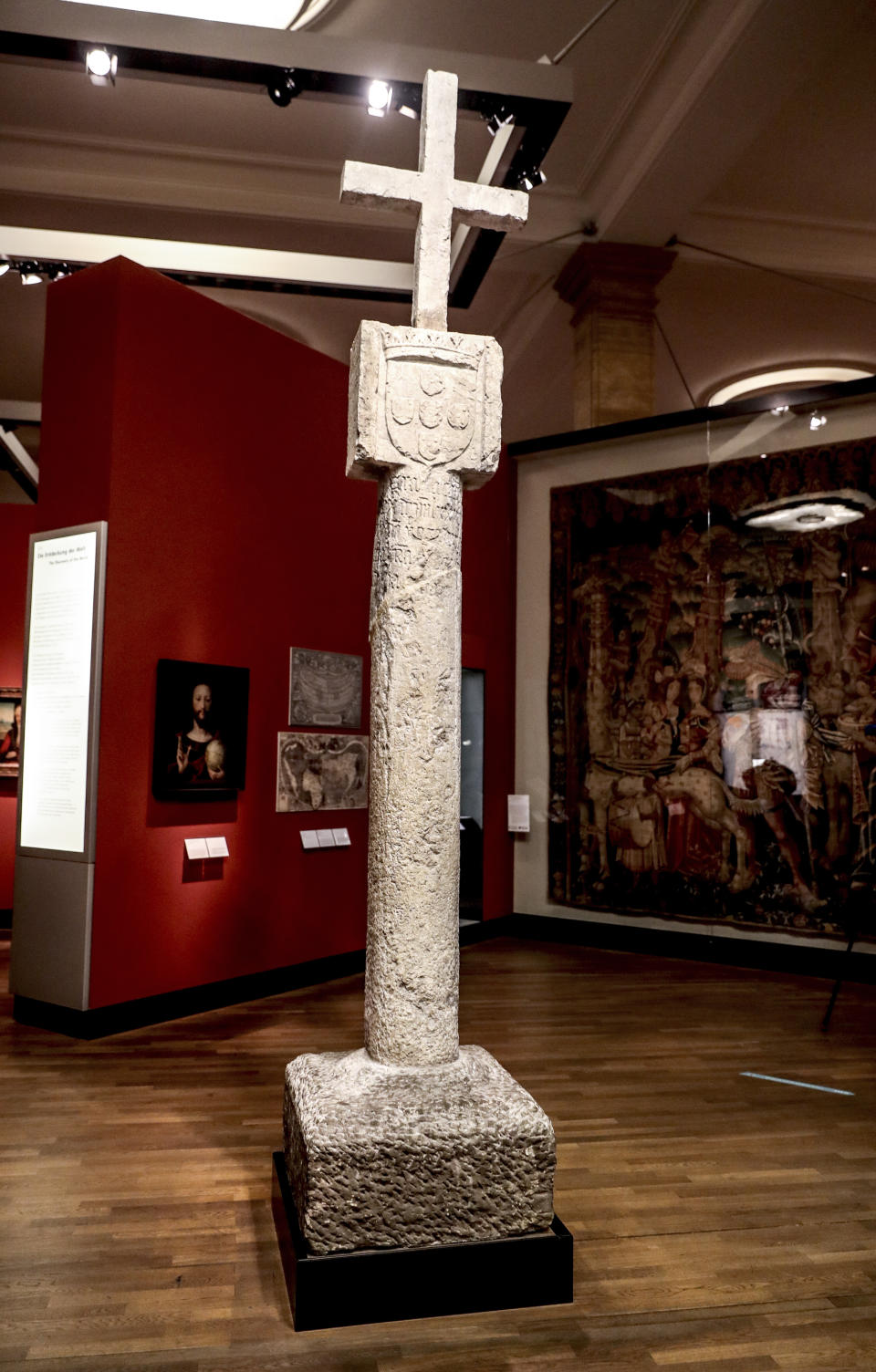 The Cape Cross column is pictured at the German Historical Museum in Berlin, Germany, Friday, May 17, 2019. The column was taken to Germany in 1893 when the area was part of the German colonial empire, and today is on display in the German Historical Museum in Berlin. Germany’s culture minister says the country is returning to Namibia the centuries-old stone cross, even though it was originally of European origin, as a gesture of reconciliation. (Britta Pedersen/dpa via AP)