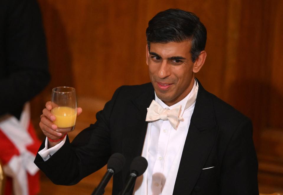 Prime minister Rishi Sunak raises his glass for a toast during the Lord Mayor’s Banquet at Guildhall in central London on 28 November 2022 (AFP via Getty Images)