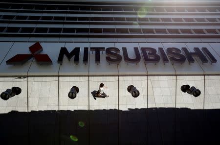 The company logo of Mitsubishi Motors is seen at its headquarters in Tokyo, Japan, May 13, 2016. REUTERS/Issei Kato/File Photo