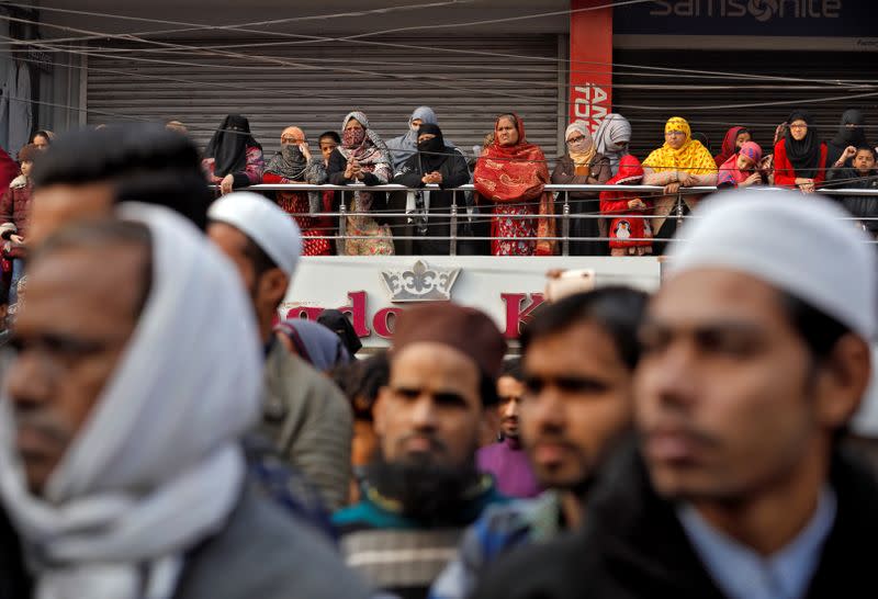 Local residents attend a protest against a new citizenship law, in New Delhi