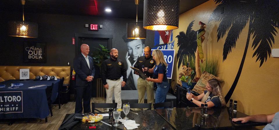 Members of the St. Lucie County Deputies Association executive board present interim Port St. Lucie Police Chief Richard Del Toro, left, with the union's official endorsement in the race for St. Lucie County Sheriff.