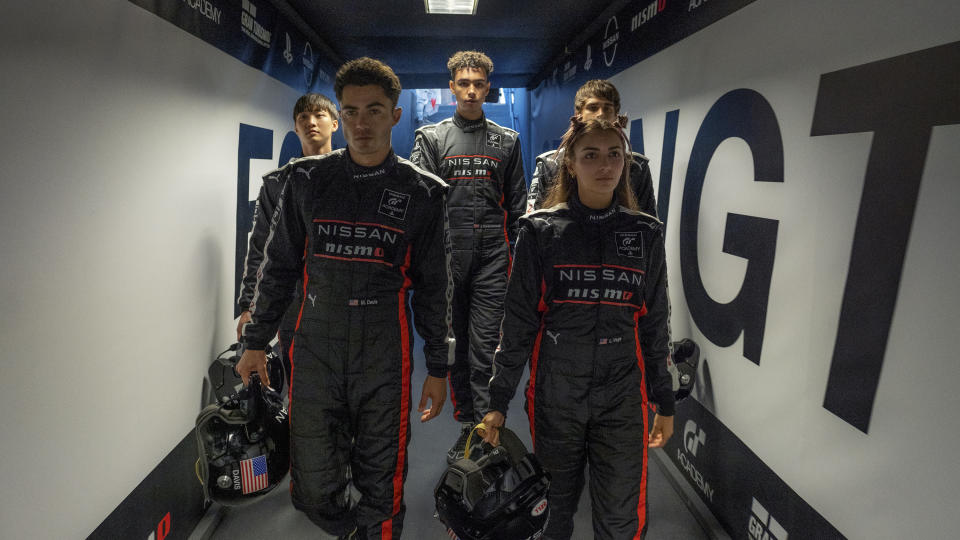 This image released by Sony Pictures shows Sang Heon Lee, from left, Darren Barnet, Archie Madekwe, Emelia Hartford and Pepe Barroso in a scene from "Gran Turismo." (Gordon Timpen/Sony Pictures via AP)