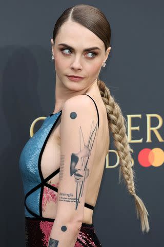 <p>Tristan Fewings/Getty</p> Cara Delevingne at the 2024 Olivier Awards.