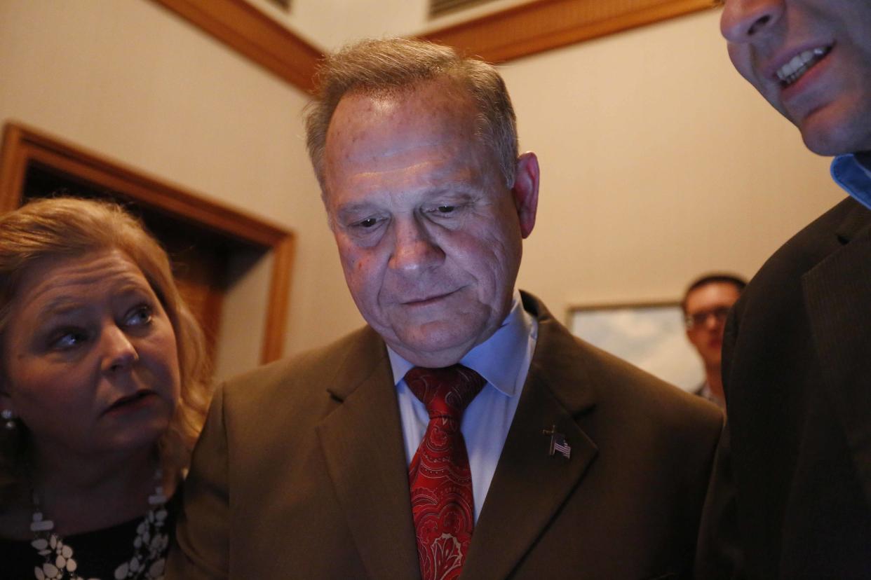 Republican Senate candidate Roy Moore looks at election returns with staff during an election-night watch party in Montgomery, Ala., on Tuesday. (Photo: Brynn Anderson/AP)