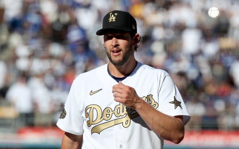 LOS ANGELES, CALIF. - JULY 19, 2022. Dodgers ace Clayton Kershaw walks off the field after pitching.