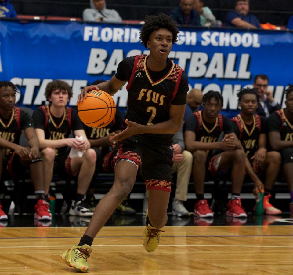 Florida High junior guard Anthony Robinson II (2) pulls-up for a shot in the FHSAA Class 3A state championship against Riviera Prep on March 4, 2022 at R.P. Funding Center in Lakeland, Fla. The Seminoles won the state title 67-66.