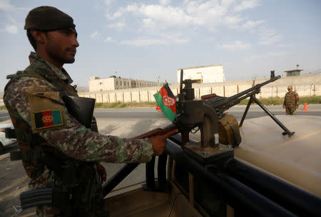 An Afghan National Army (ANA) soldier keeps watch at a checkpoint in Kabul, Afghanistan, August 22, 2017. REUTERS/Omar Sobhani