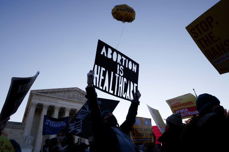 Anti-abortion and pro-abortion rights protesters gather outside Supreme Court in Washington