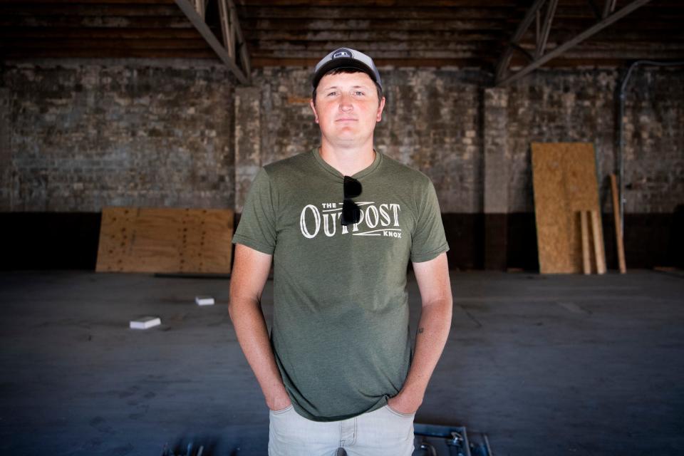 Born & Raised Productions' Garrett Thomson is photographed inside what will be The Outpost music venue in downtown Knoxville on Thursday, Oct. 14, 2021. A concert promoter, Thomson did everything he could to make money while COVID-19 affected the live music industry, from building cabinets to DJing weddings.