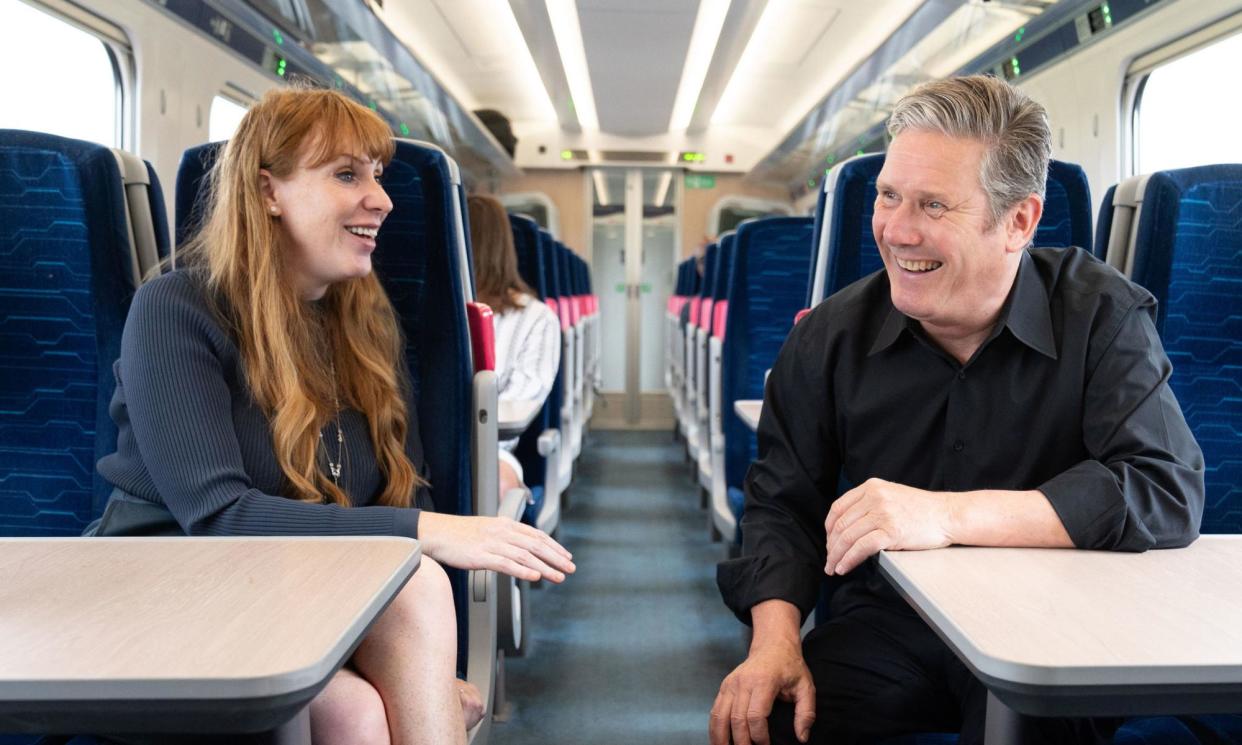 <span>Angela Rayner and Keir Starmer on a train to the Selby by-election in 2023.</span><span>Photograph: Stefan Rousseau/PA</span>