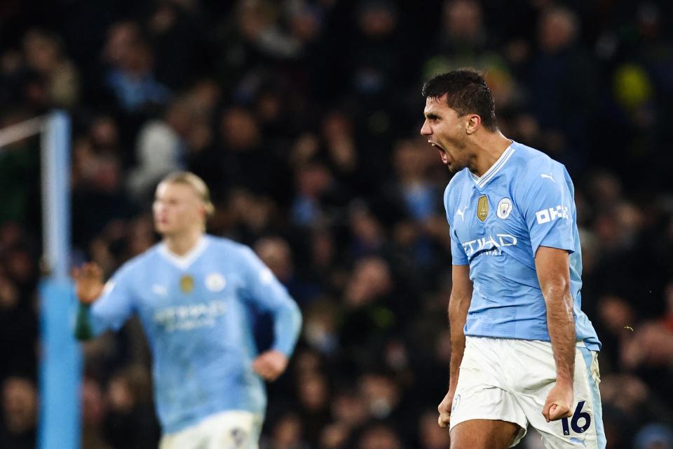 Manchester City's Spanish midfielder #16 Rodri celebrates after scoring his team first goal during the English Premier League football match between Manchester City and Chelsea at the Etihad Stadium in Manchester, north west England, on February 17, 2024. (Photo by Darren Staples / AFP) / RESTRICTED TO EDITORIAL USE. No use with unauthorized audio, video, data, fixture lists, club/league logos or 'live' services. Online in-match use limited to 120 images. An additional 40 images may be used in extra time. No video emulation. Social media in-match use limited to 120 images. An additional 40 images may be used in extra time. No use in betting publications, games or single club/league/player publications. / (Photo by DARREN STAPLES/AFP via Getty Images)