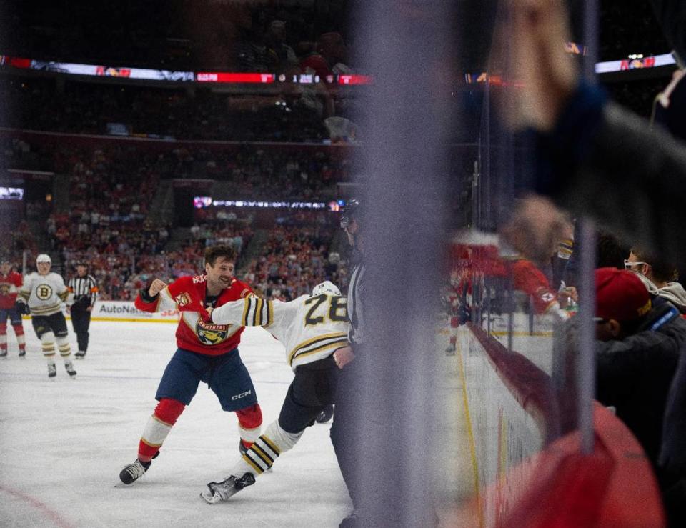 Florida Panthers Jonah Gadjovich (12) swings at Boston Bruins defenseman Derek Forbort (28) during the second period of a NHL game on Wednesday, Nov. 22, 2023, at Amerant Bank Arena in Sunrise, Fla.