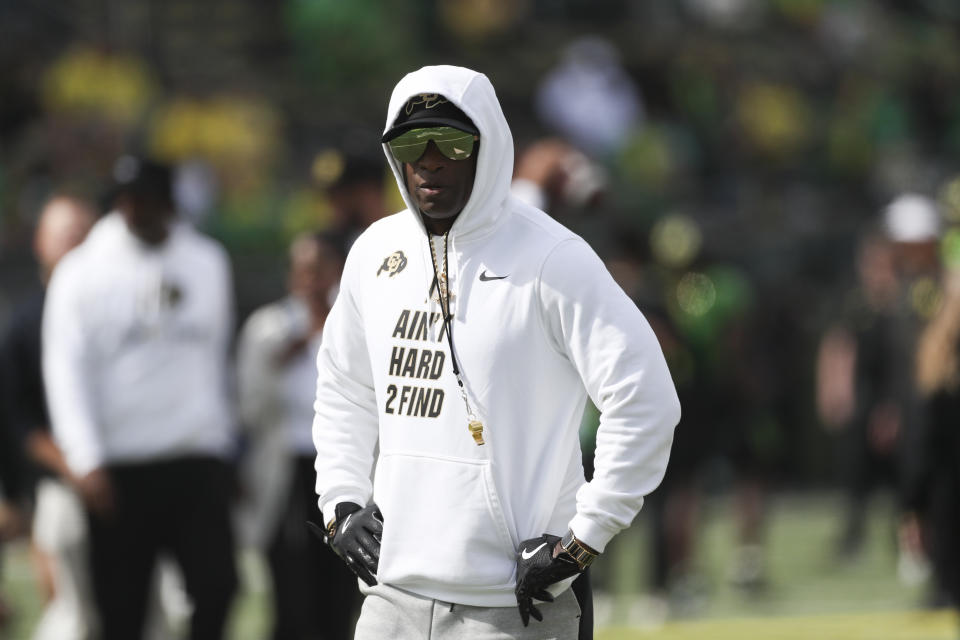 Colorado head coach Deion Sanders looks on during warm ups before an NCAA football game against Oregon, Saturday, Sept. 23, 2023, in Eugene, Ore. (AP Photo/Amanda Loman)