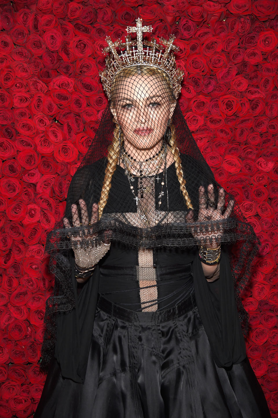 Madonna wears a black robe, lace veil and silver crown at the Heavenly Bodies: Fashion & The Catholic Imagination Costume Institute Gala at The Metropolitan Museum of Art on May 7, 2018 in New York City