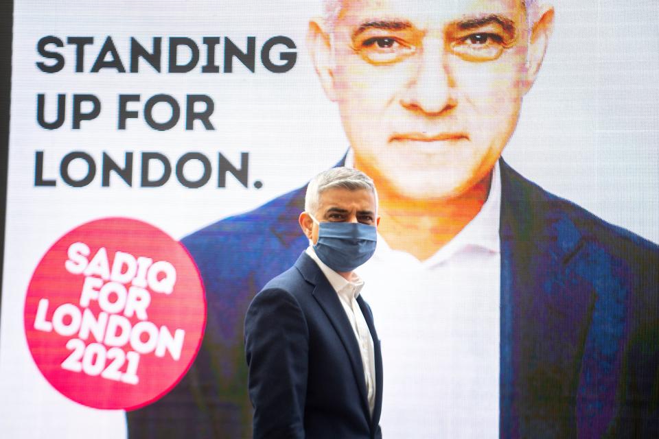 Sadiq Khan unveiling a new campaign advert while out on the campaign trail on Thursday (PA)