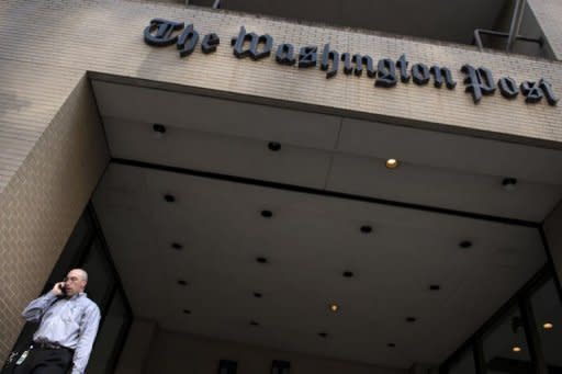 A man departs The Washington Post building on August 5, 2013 in Washington, DC. As at other papers, circulation is plummeting, down 8.6 percent last year and falling at a 7.1 percent rate for the first half of 2012, to around 448,000 daily