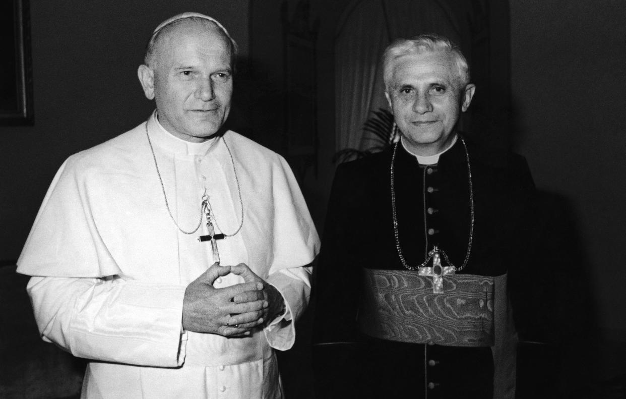 FILE - Pope John Paul II, left, stands next to German Cardinal Joseph Ratzinger at the Vatican in 1979. Ratzinger went on to become Pope Benedict XVI. Pope Emeritus Benedict XVI, the German theologian who will be remembered as the first pope in 600 years to resign, has died, the Vatican announced Saturday. He was 95. (AP Photo, File)