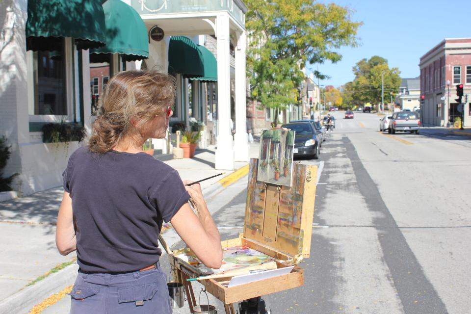 A person paints during Plymouth Arts Center’s annual Paint the Towns in Fall Color, En Plein Air event.