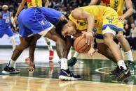 Jan 21, 2019; Milwaukee, WI, USA; Milwaukee Bucks guard Malcolm Brogdon (13) grabs a loose ball against Dallas Mavericks center DeAndre Jordan (6) in the third quarter at the Fiserv Forum. Mandatory Credit: Benny Sieu-USA TODAY Sports