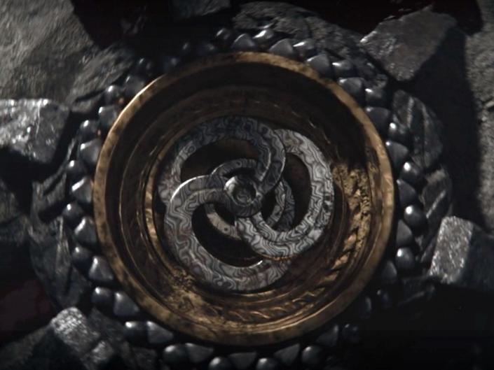 A stone carving showing three connecting rings of Valyrian steel.