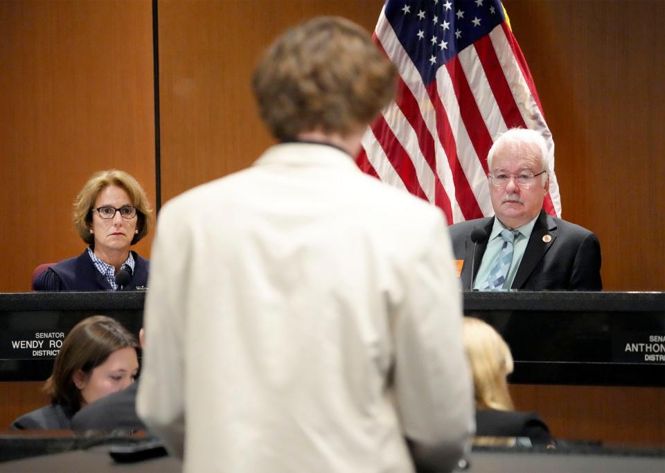 Sen. Wendy Rogers and Sen. John Kavanagh listen to Connor Jarnagan, a victim of a brass knuckles attack, as he speaks at a Senate judiciary hearing where a brass knuckles bill is being proposed on Feb. 1, 2024.