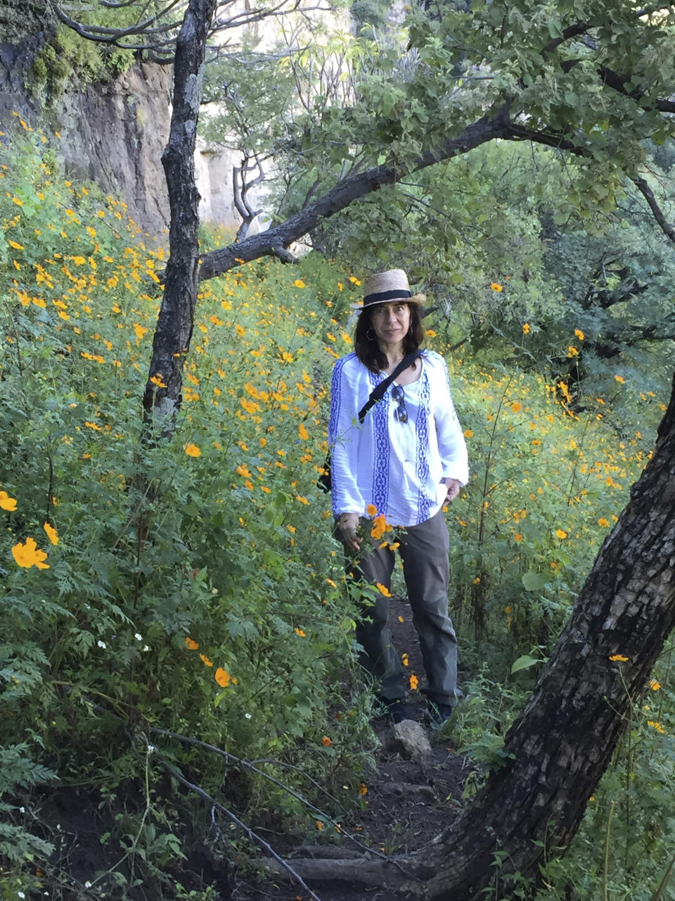 In this photo courtesy of Mark Stevenson, longtime Mexico reporter Jo Tuckman pauses for a photo as she visits Malinalco, Mexico, Saturday, Oct. 14, 2017. The British journalist died of cancer on July 9, 2020, at the age of 53 after a distinguished 20-year career of reporting on the country. (Mark Stevenson via AP)