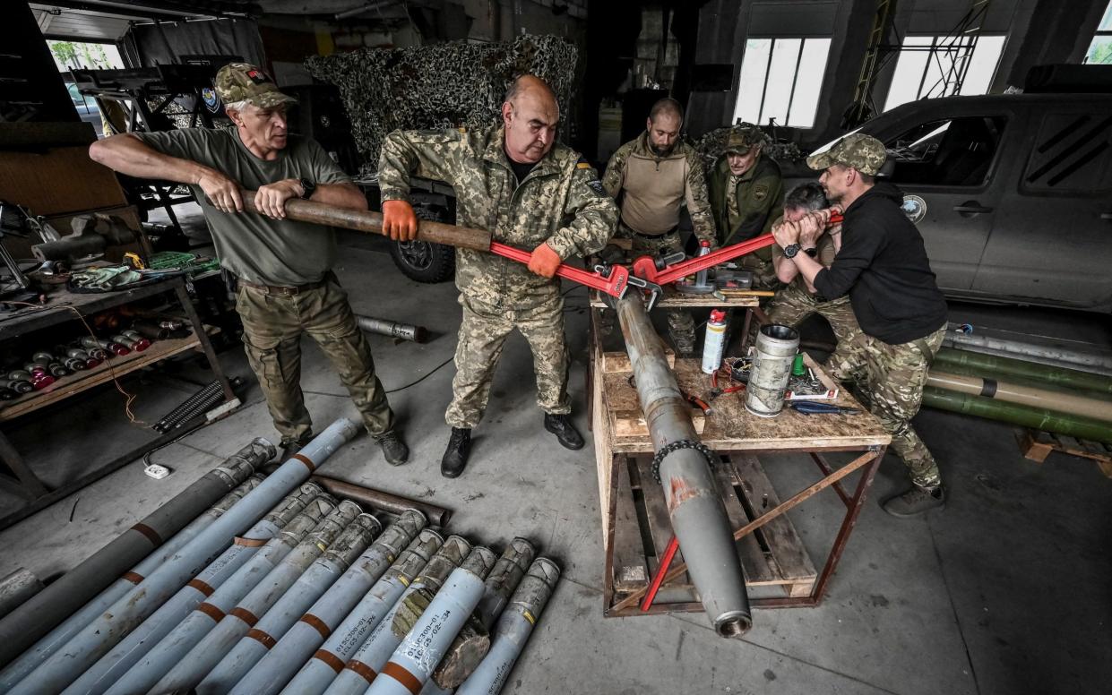 Ukrainians disassembling a shell for a launch rocket system to be used for firing towards Russian troops