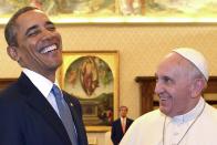 FILE - In this March 27, 2014 file photo, Pope Francis and President Barack Obama smile as they meet at the Vatican. President Joe Biden is scheduled to meet with Pope Francis on Friday, Oct. 29, 2021. Biden is only the second Catholic president in U.S. history. (AP Photo/Gabriel Bouys, Pool, File)