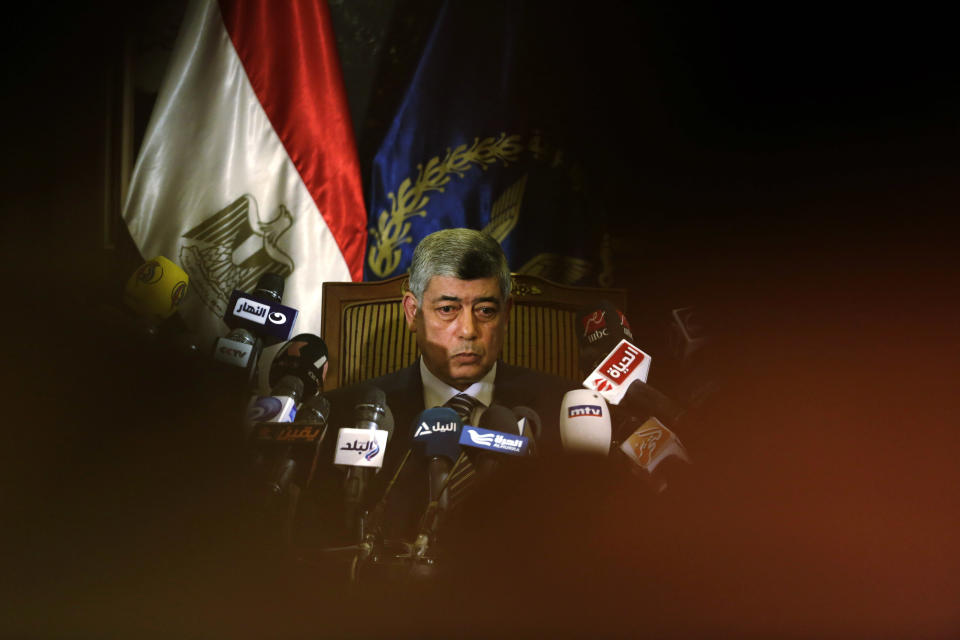 Egypt's Interior Minister Mohammed Ibrahim listens to a question during a press conference in Cairo, Egypt, Sunday, March 30, 2014. Ibrahim said his agents seized the documents, smuggled out of the presidential palace, before they were leaked to Qatar-based Al-Jazeera network, and the intelligence agency of an Arab country allied with the Muslim Brotherhood. (AP Photo/Hassan Ammar)