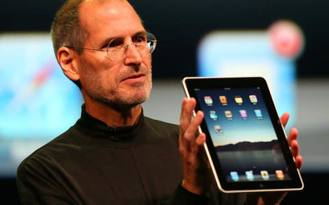 Steve Jobs with the Apple iPad - Credit:  Jim Wilson