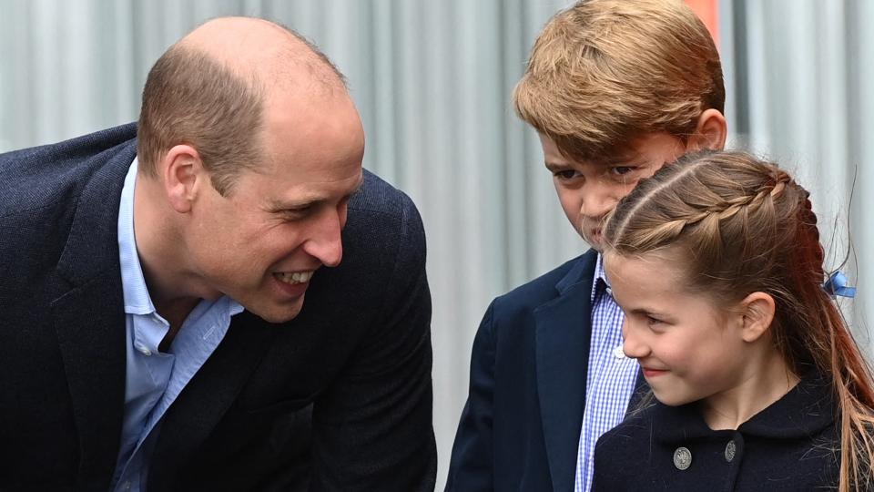 Cheeky father-daughter grins