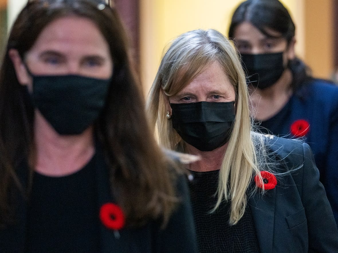 Tracy Kitch, centre, the former chief executive of the IWK Health Centre, a children's hospital, heads from provincial court during a break in Halifax on Monday, Nov. 8, 2021. Kitch is charged with breach of trust and fraud over $5,000 related an investigation into her expenses while she was the senior executive of the facility. (Andrew Vaughan/The Canadian Press - image credit)