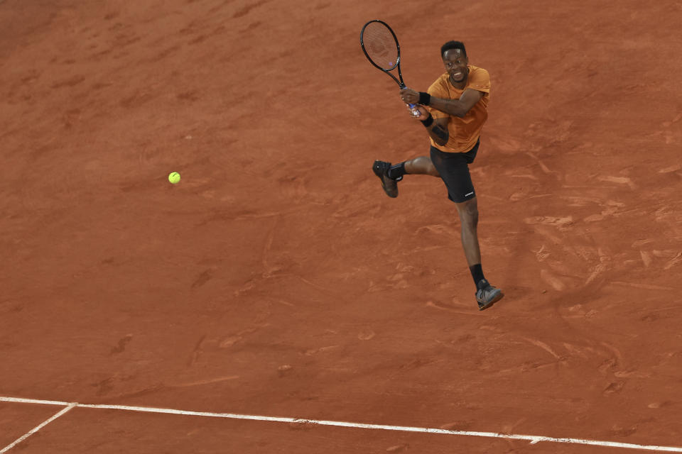 France's Gael Monfils plays a shot against Argentina's Sebastian Baez during their first round match of the French Open tennis tournament at the Roland Garros stadium in Paris, Tuesday, May 30, 2023. (AP Photo/Aurelien Morissard)