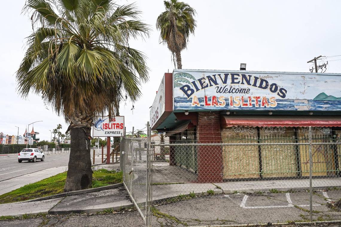 The former Mariscos Las Islitas is closed off and fenced in on E Kings Canyon Road near the Big Fresno Fairgrounds on Tuesday, Feb. 28, 2023. It represents the blight that some of the area has experienced over the years.