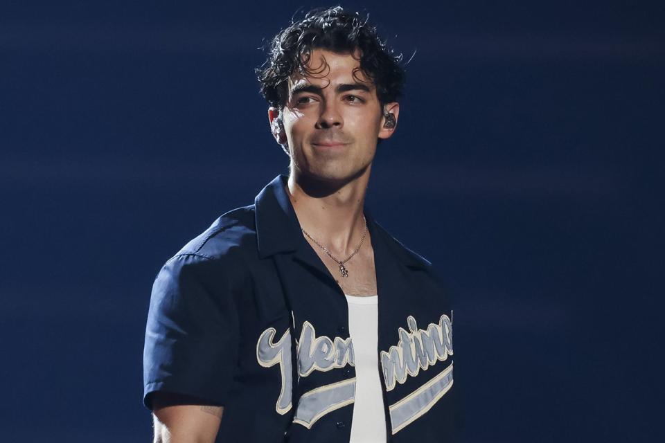 <p>Scott Legato/Getty Images</p> Joe Jonas performs onstage during Jonas Brothers Five Albums, One Night Tour at Little Caesars Arena on August 24, 2023 in Detroit, Michigan