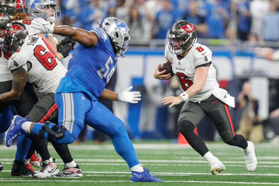 Tampa Bay Buccaneers quarterback Baker Mayfield (6) runs against Detroit Lions during the first half of the NFC divisional round at Ford Field in Detroit on Sunday, Jan. 21, 2024.
