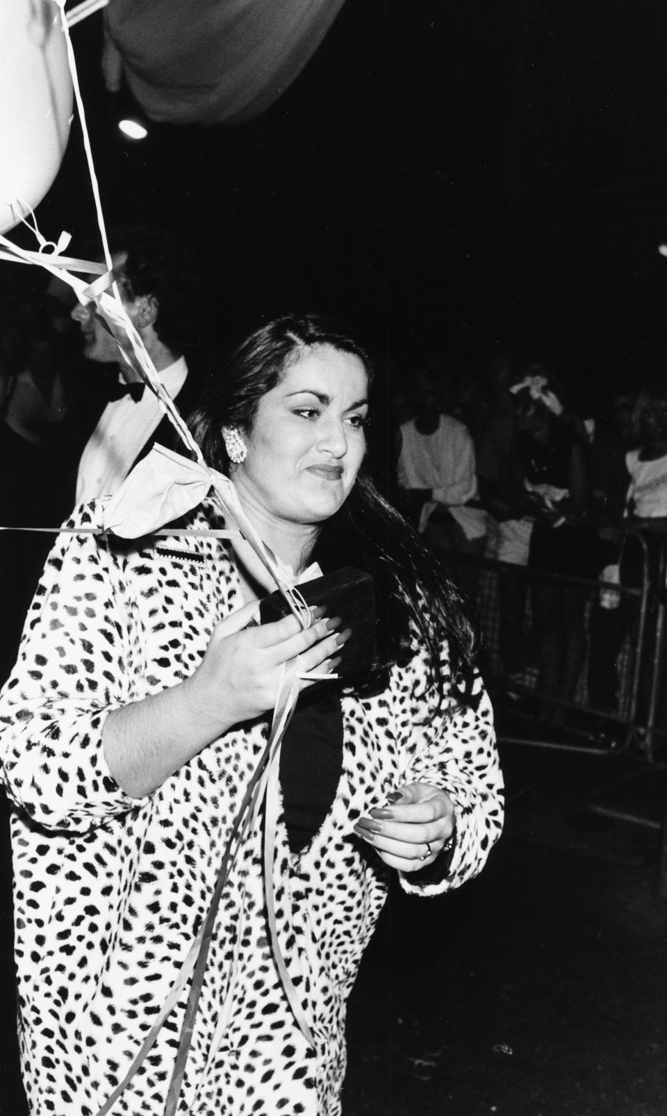 Melanie Panayiotou, sister of singer George Michael, holding balloons as she attends the Wham! farewell party, London, July 8th 1986. (Photo: Dave Hogan/Getty Images)