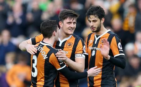 Britain Soccer Football - Hull City v West Ham United - Premier League - The Kingston Communications Stadium - 1/4/17 Hull City's Andrea Ranocchia, Harry Maguire and Andrew Robertson celebrate after the match Reuters / Scott Heppell Livepic