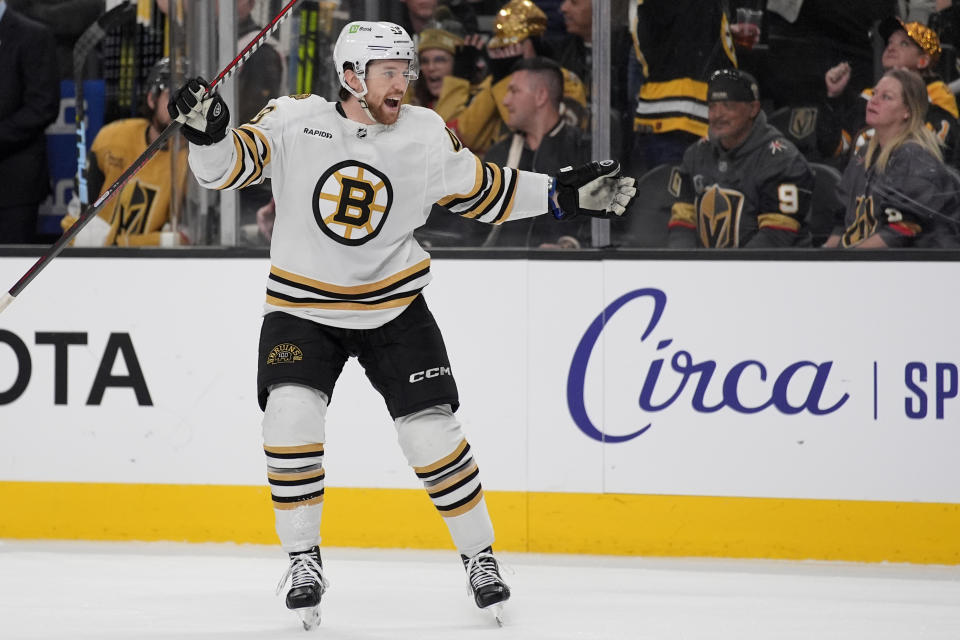 Boston Bruins defenseman Matt Grzelcyk (48) celebrates after scoring against the Vegas Golden Knights during the third period of an NHL hockey game Thursday, Jan. 11, 2024, in Las Vegas. (AP Photo/John Locher)