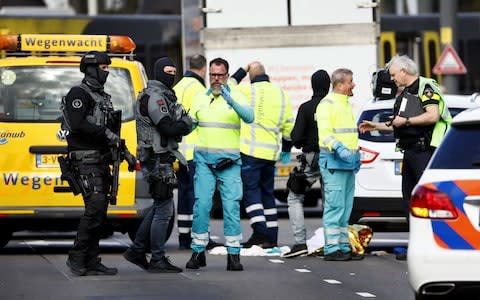 Police forces and emergency services stand at the 24 Oktoberplace in Utrecht - Credit: Robin Van Lonkhuijsen/AFP