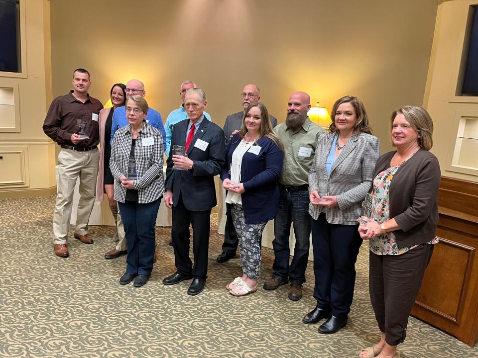 Honorees at the Heroes of Preservation and History ceremony pose for a picture Thursday at the Geib Funeral Center in Dover.