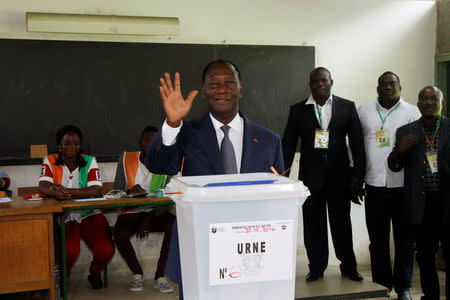 Ivory Coast's President Alassane Ouattara waves after his vote at a polling station of the lycee St Marie during a referendum on a new constitution, in Abidjan, Ivory Coast October 30, 2016. REUTERS/Luc Gnago